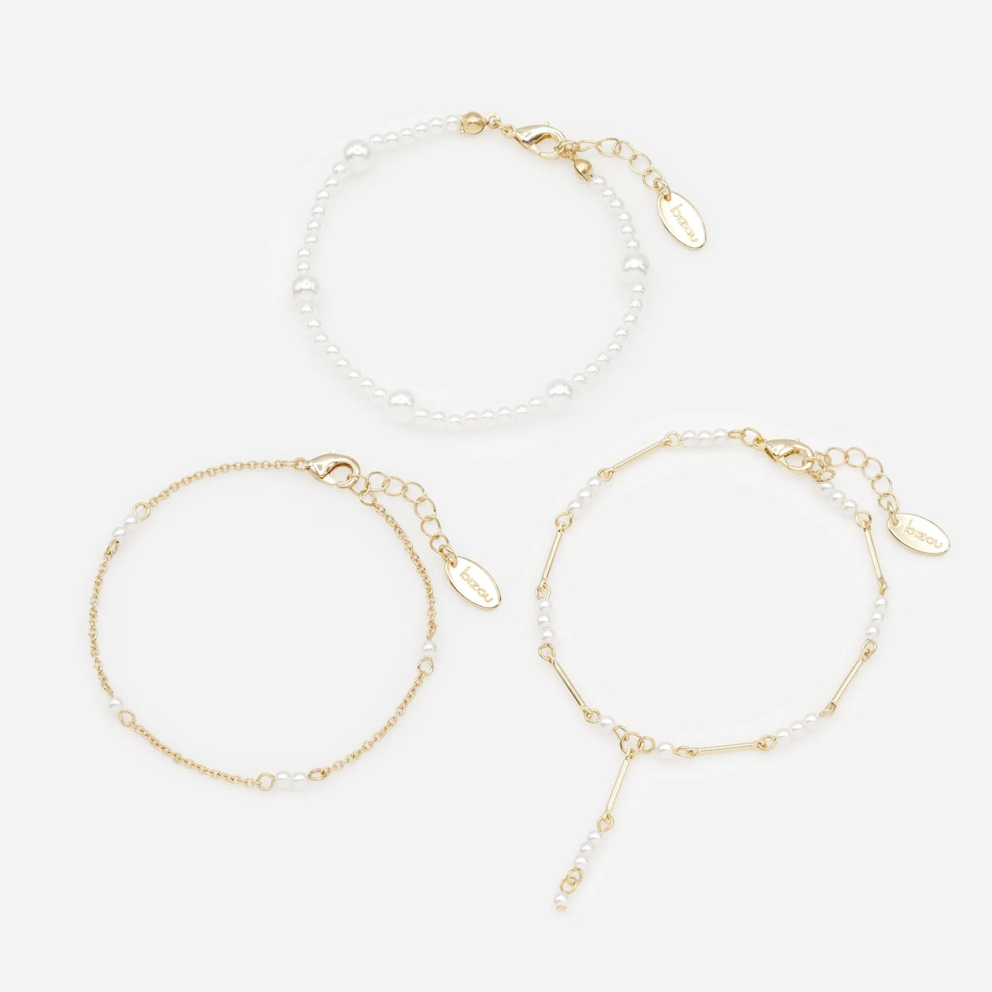 Golden bracelet trio with pearls