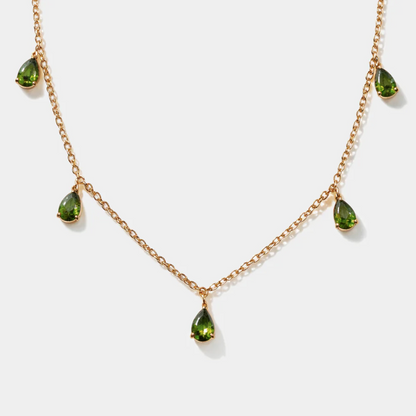 Golden necklace with green stone charm