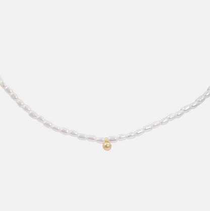 Synthentic pearl necklace with gold charm