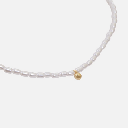 Synthentic pearl necklace with gold charm